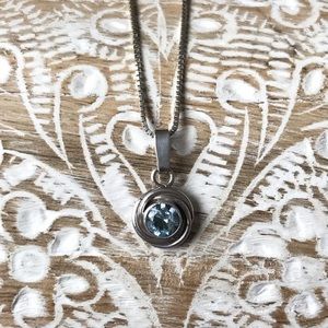 Sterling silver necklace with clear blue stone